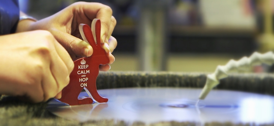 Rachel coldworking a little glass hare in the studio